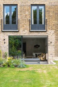 exterior shot of home with black sliding doors